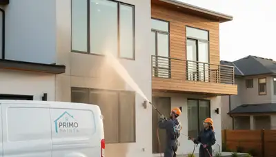 Professional pressure cleaning a home exterior in Olathe, KS for house washing and paint prep