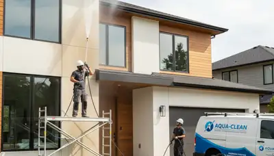 Professional pressure cleaning service washing a home exterior in Olathe, KS
