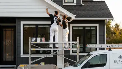 Professional trim and fascia painting on a home exterior in Olathe, KS by expert house painters